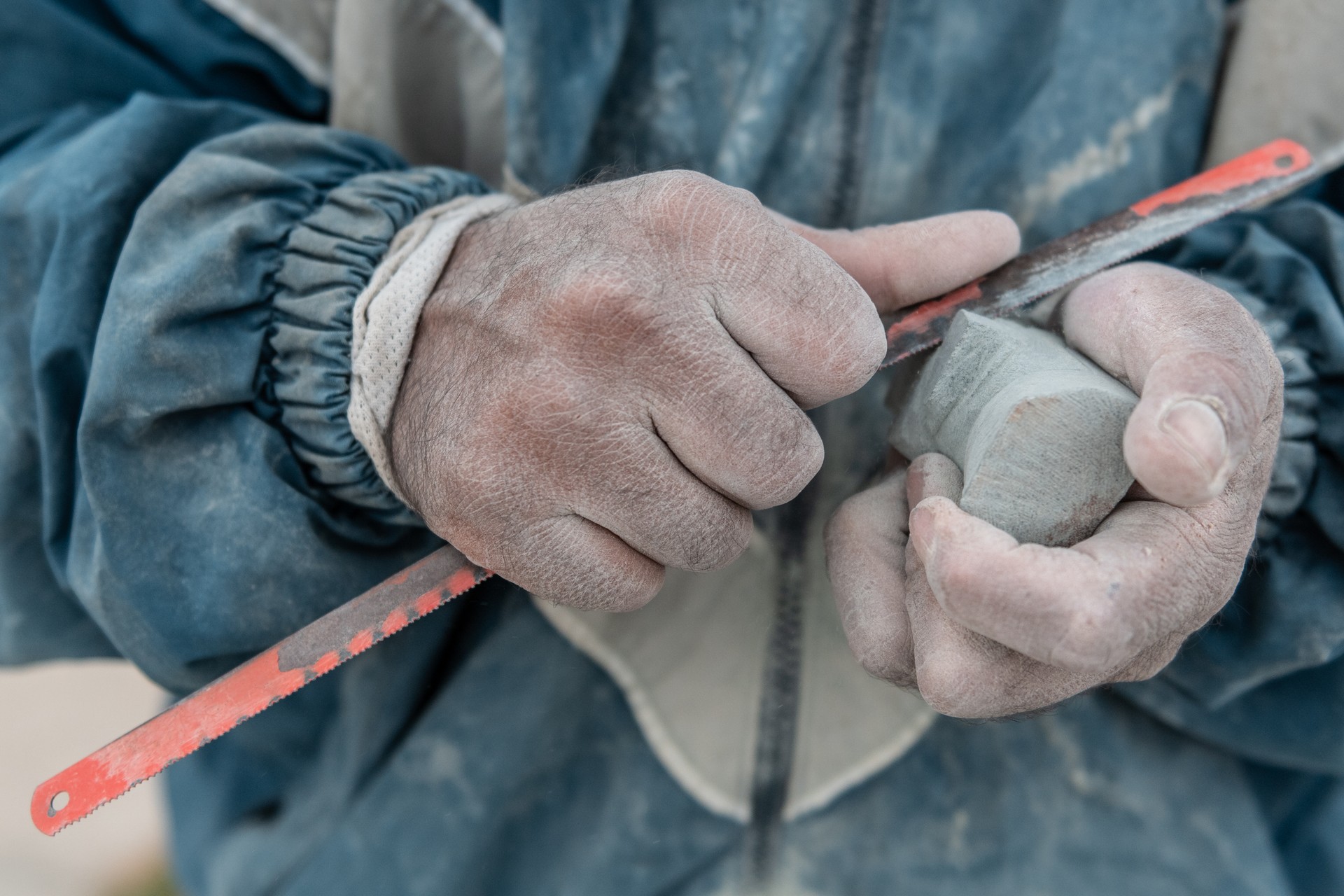 Man hands carving stone